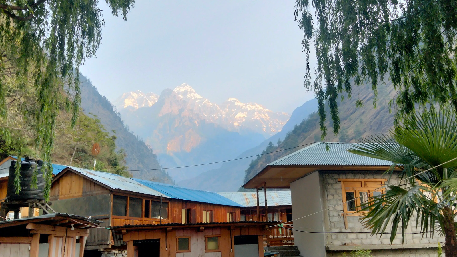 Accommodation in Dang Village on the Manaslu Circuit Trek, traditional teahouse lodge surrounded by Himalayan mountain landscape in Nepal.