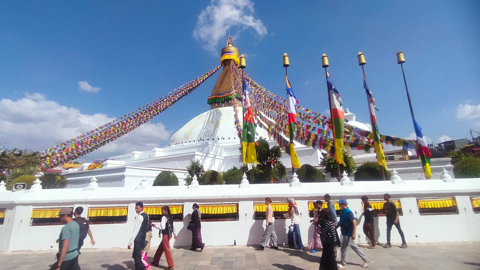 Boudhanath Stupa at sunrise — prayer flags and soft morning light