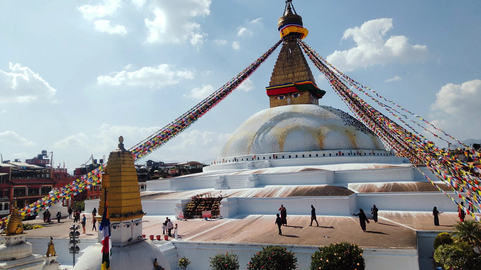 Boudhanath Stupa lens flare — sun reflecting off the white dome