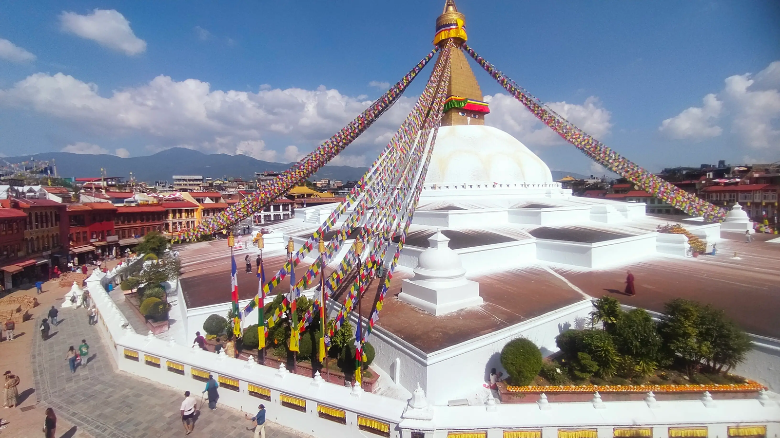 Boudhanath Stupa night view — illuminated dome and Tibetan prayer wheels