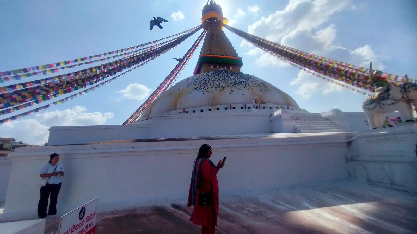 Boudhanath Stupa prayer wheels closeup — spinning mani wheels tradition