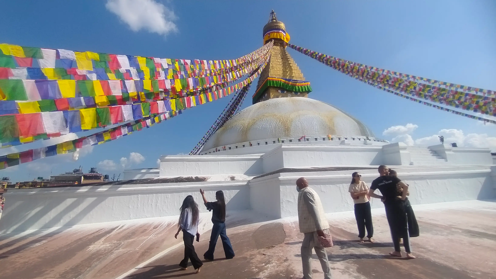 Boudhanath Stupa rooftop view — terraces, shops and prayer mani stones