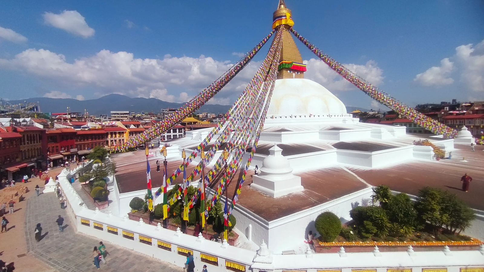 Boudhanath Stupa wide angle — full dome, plazas and surrounding gompas