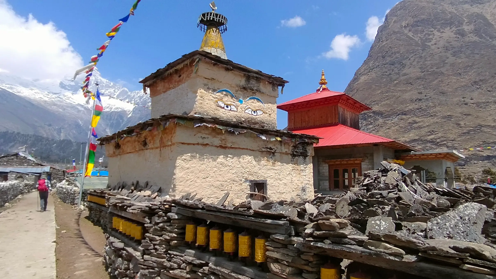 Buddhist monastery in Samagaon village along the Manaslu Circuit Trek, featuring a serene high-altitude landscape and snow-capped Himalayas.
