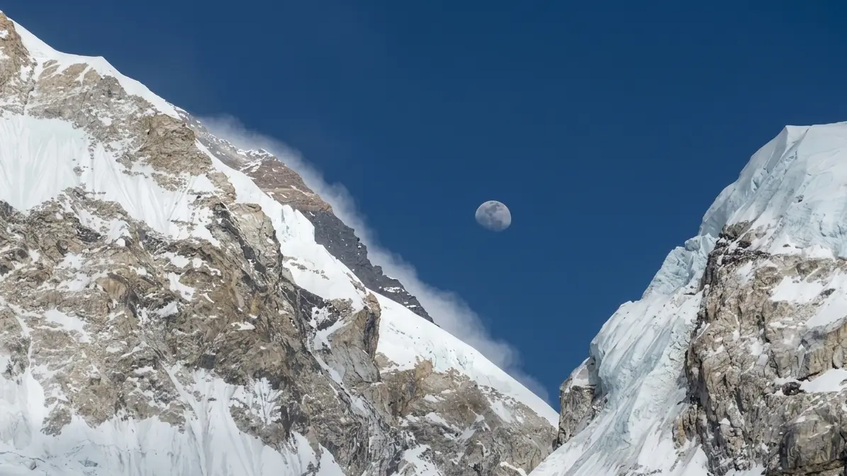 Moon rising over snow-covered Himalayan peaks