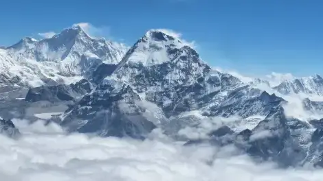Makalu Base Camp Trek – Majestic view of Mount Makalu and surrounding Himalayan peaks rising above the clouds in eastern Nepal.