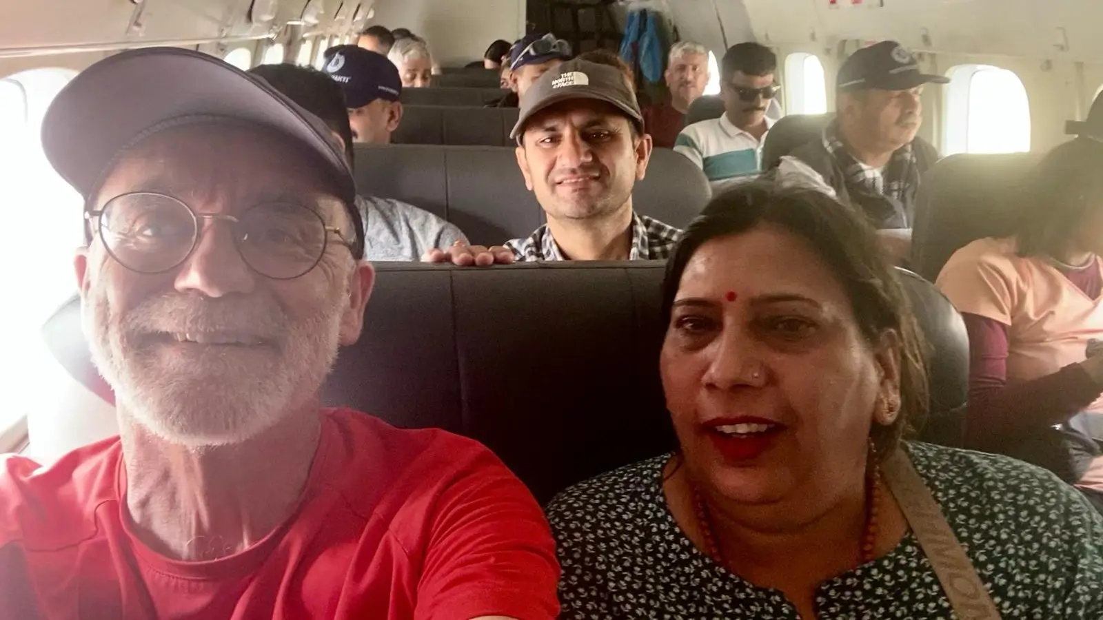 Passengers onboard a Ramechhap to Lukla flight in Nepal, enjoying a scenic Himalayan air journey on the Everest Base Camp Trek route to Lukla Airport—a gateway to adventure travel.