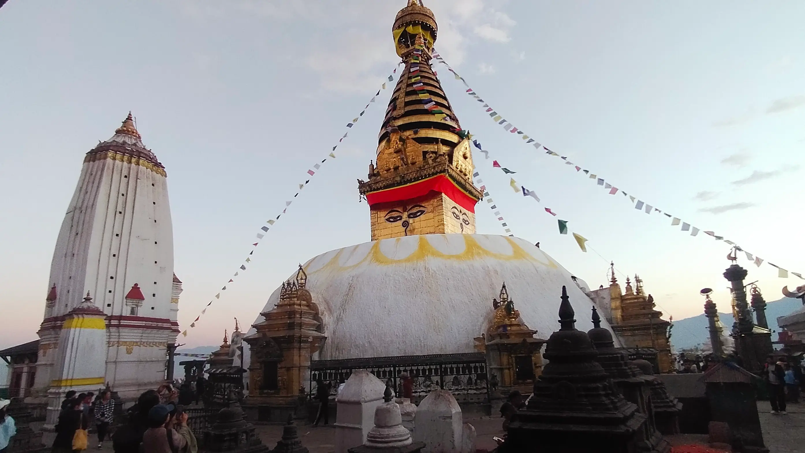 Swayambhunath pilgrimage site devotees spinning prayer wheels