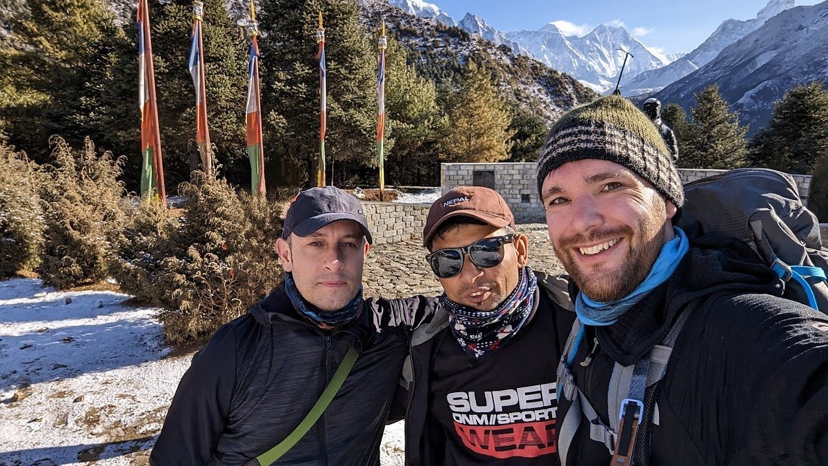 Trekkers enjoying panoramic views of Mount Everest on the Everest View Trek near Namche Bazaar, Nepal – clear skies and snow-dusted trails